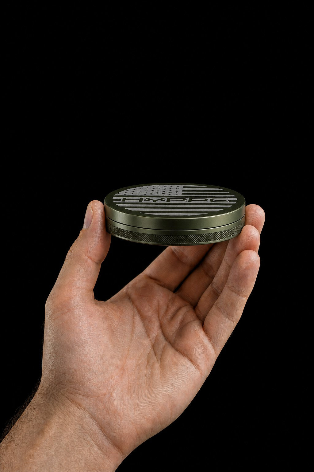 Hand holding the closed HYPPE slim aluminum can edge-on to show how thin it is