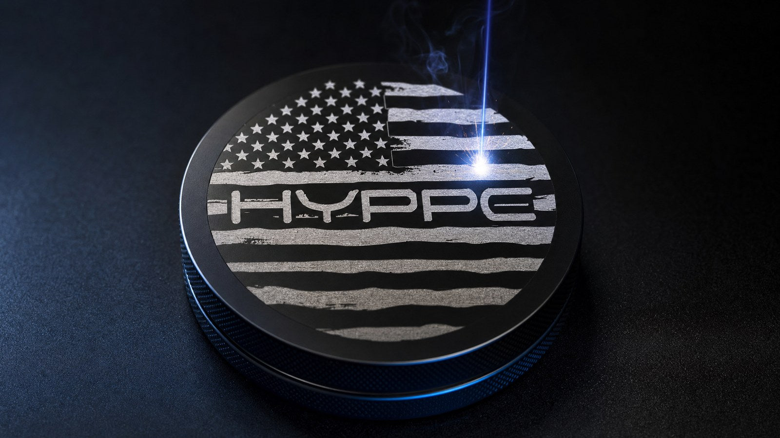 A laser engraving the HYPPE flag design into a black can lid