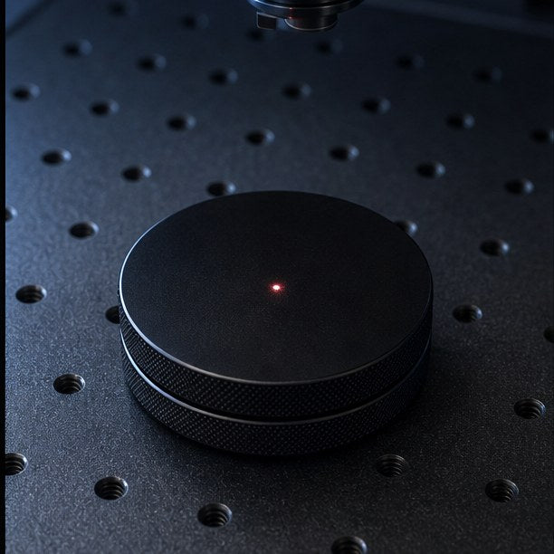 A blank black HYPPE can on the laser bed, lined up for engraving